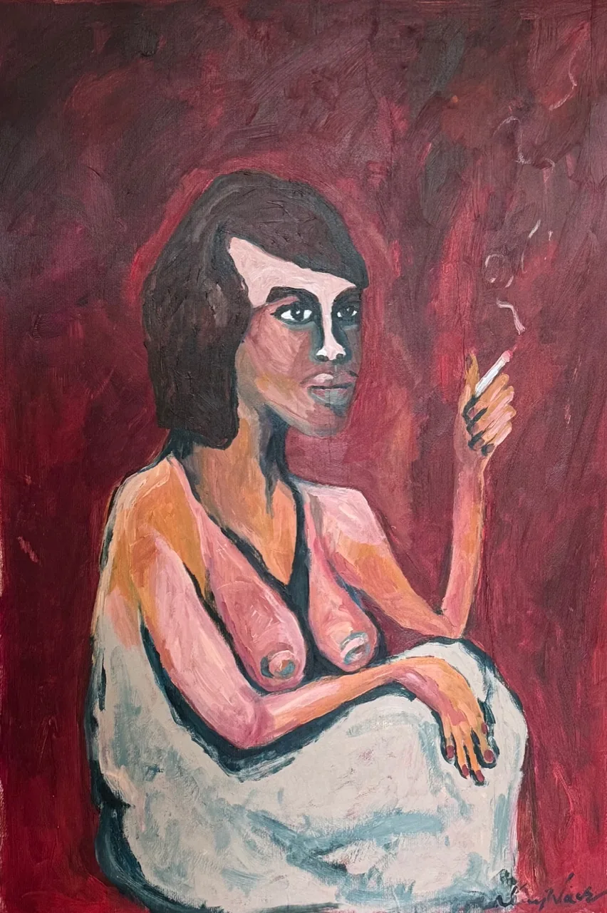 A seated woman holding a cigarette