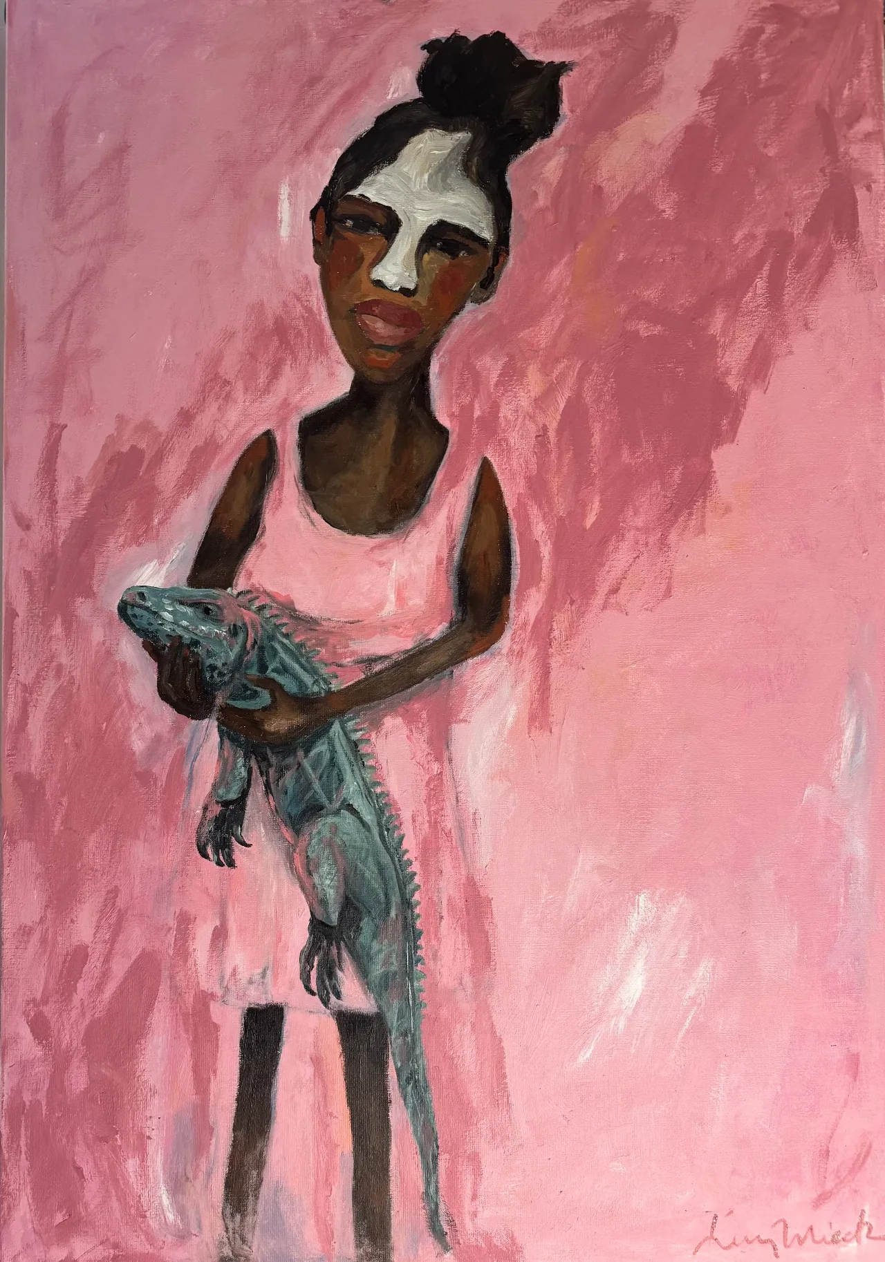 Girl in a pink dress holding a teal iguana
