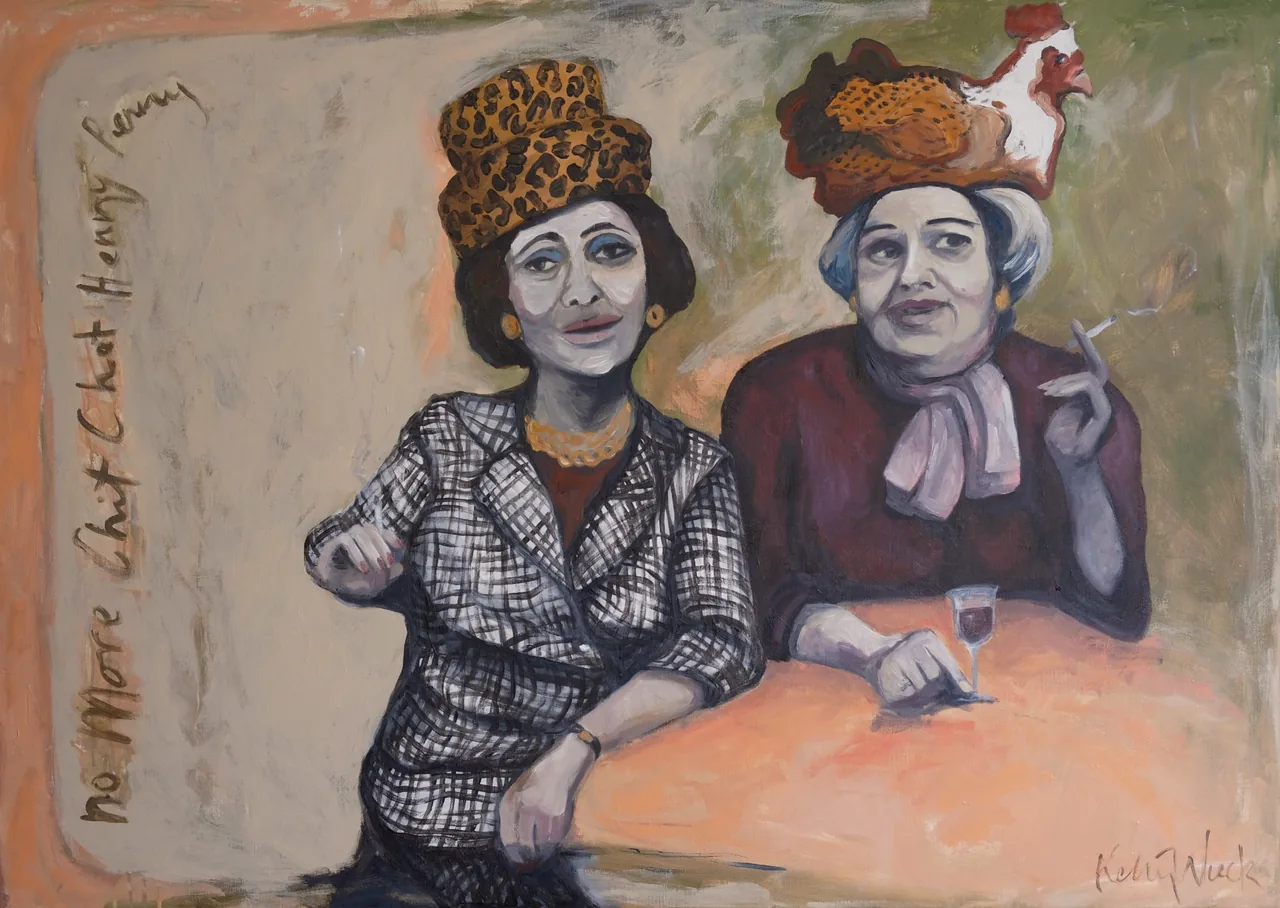 Two women in novelty hats seated at a table, titled No More Chit Chat Henny Penny